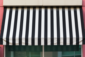 universal-awning-using-an-awning-to-beat-the-summer-july-300x251
